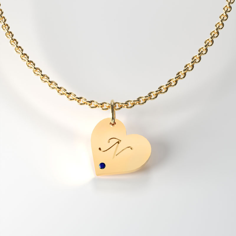 Gold heart Shaped tag, with sapphire. Available in 9,14 and 18 Carats